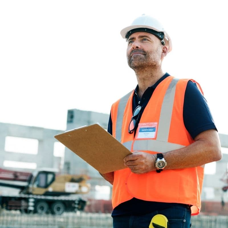 Worker wearing a hard hat and safety badge